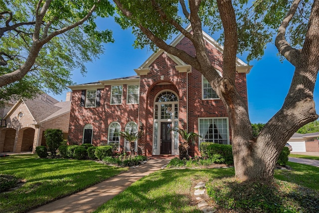 4707 Gladesdale Park Ln, Katy, TX 77450 - traditional-style home featuring brick siding and a front lawn