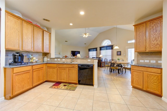 21714 Honeysuckle Grove Ln, Richmond, TX 77469 - kitchen with black dishwasher, a sink, a peninsula, light tile patterned floors, and decorative backsplash