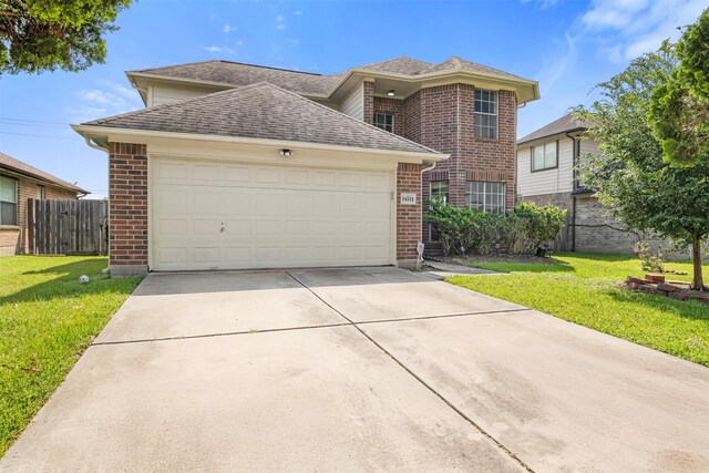 14531 County Cress Dr, Houston, TX 77047 - traditional-style house featuring brick siding, concrete driveway, an attached garage, and a shingled roof