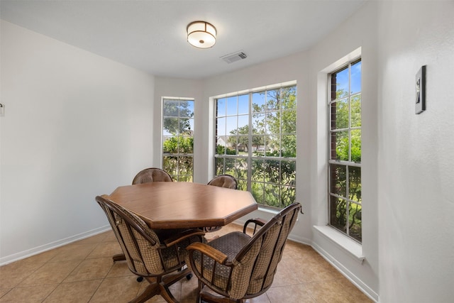 14531 County Cress Dr, Houston, TX 77047 - dining space with light tile patterned flooring and baseboards
