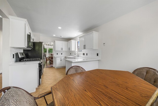 14531 County Cress Dr, Houston, TX 77047 - dining space with light tile patterned flooring, a chandelier, and recessed lighting