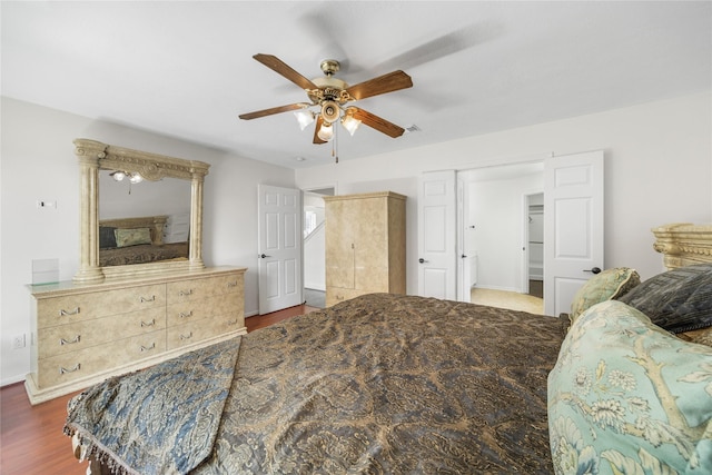14531 County Cress Dr, Houston, TX 77047 - bedroom with wood finished floors, a ceiling fan, and baseboards