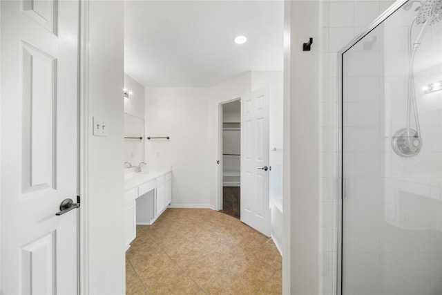 14531 County Cress Dr, Houston, TX 77047 - bathroom featuring vanity, a shower stall, tile patterned flooring, a walk in closet, and recessed lighting