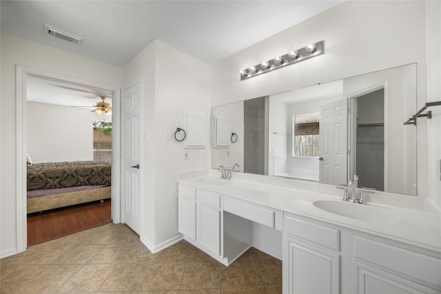 14531 County Cress Dr, Houston, TX 77047 - bathroom featuring double vanity, tile patterned floors, ceiling fan, ensuite bath, and a closet