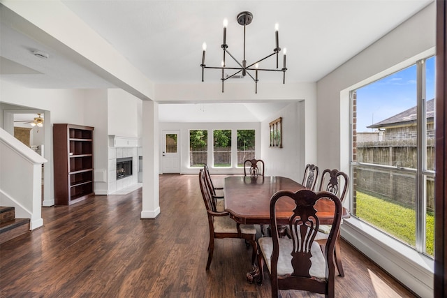 14531 County Cress Dr, Houston, TX 77047 - dining space with plenty of natural light, a chandelier, dark wood-style floors, and stairs