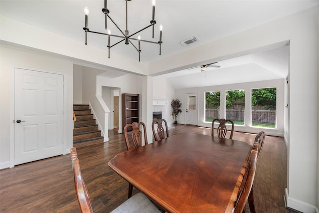 14531 County Cress Dr, Houston, TX 77047 - dining room featuring a chandelier, stairs, wood finished floors, baseboards, and a fireplace