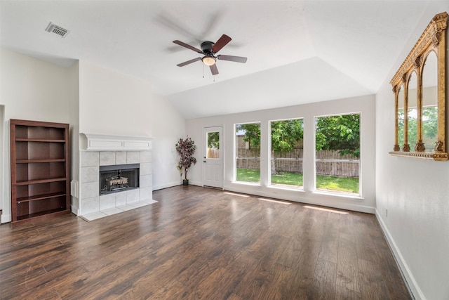 14531 County Cress Dr, Houston, TX 77047 - unfurnished living room with lofted ceiling, ceiling fan, a tile fireplace, wood finished floors, and baseboards