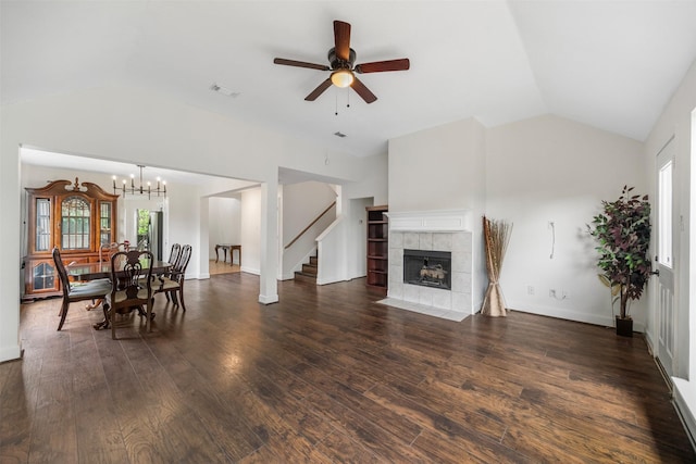 14531 County Cress Dr, Houston, TX 77047 - living room with vaulted ceiling, healthy amount of natural light, a ceiling fan, wood finished floors, and a chandelier