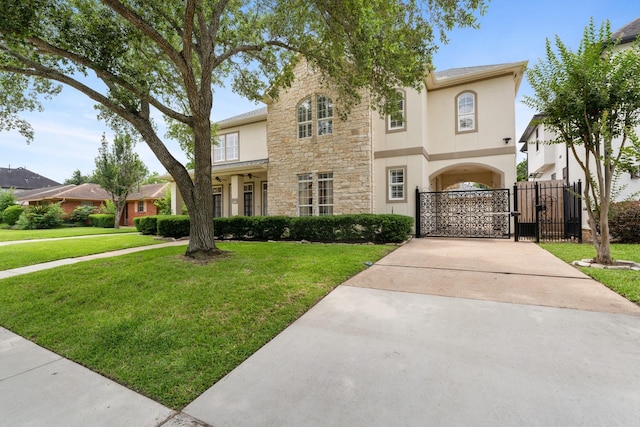 4021 Glenshire St, Houston, TX 77025 - traditional-style home with a gate, stucco siding, stone siding, and concrete driveway