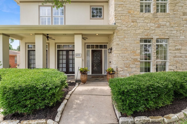 4021 Glenshire St, Houston, TX 77025 - property entrance with a ceiling fan, stone siding, french doors, and a porch