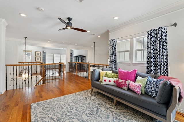 4021 Glenshire St, Houston, TX 77025 - living room with ceiling fan, ornamental molding, wood finished floors, and recessed lighting