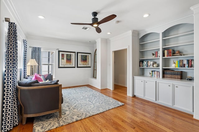 4021 Glenshire St, Houston, TX 77025 - living room with ceiling fan, wood finished floors, crown molding, baseboards, and recessed lighting