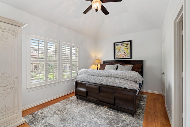 4021 Glenshire St, Houston, TX 77025 - bedroom featuring multiple windows, wood finished floors, lofted ceiling, baseboards, and ceiling fan