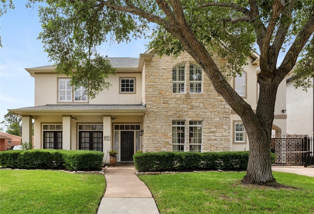 4021 Glenshire St, Houston, TX 77025 - traditional-style house with stone siding, stucco siding, and roof with shingles