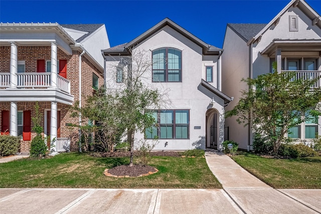 5038 Galahad Ct, Missouri City, TX 77459 - view of front of house featuring stucco siding, a front lawn, and brick siding