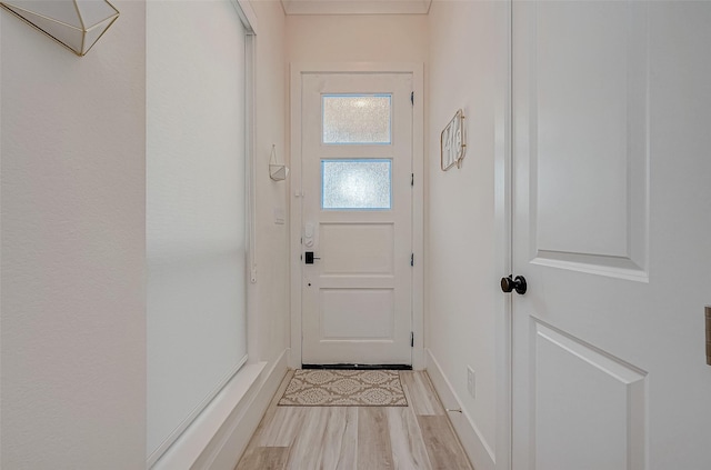 5038 Galahad Ct, Missouri City, TX 77459 - doorway to outside with light wood-type flooring and baseboards