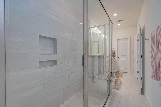 5038 Galahad Ct, Missouri City, TX 77459 - bathroom with a shower stall, baseboards, tile patterned flooring, and recessed lighting