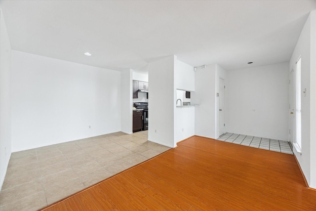 8020 Braesmain Dr Unit 1710, Houston, TX 77025 - unfurnished living room with light tile patterned floors