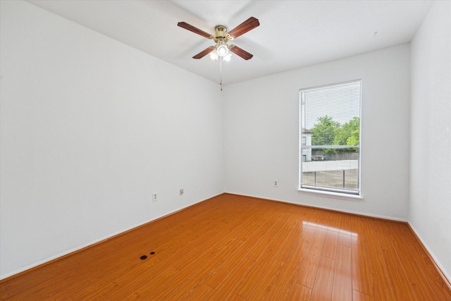 8020 Braesmain Dr Unit 1710, Houston, TX 77025 - spare room with a ceiling fan, light wood-type flooring, and baseboards