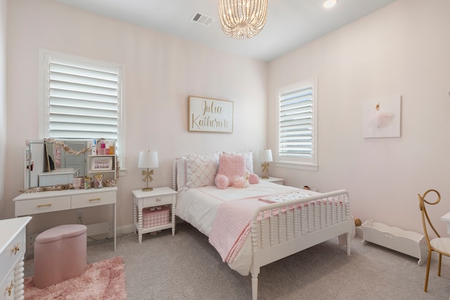 6914 Champion Trl, Katy, TX 77493 - bedroom with light carpet, a chandelier, and baseboards