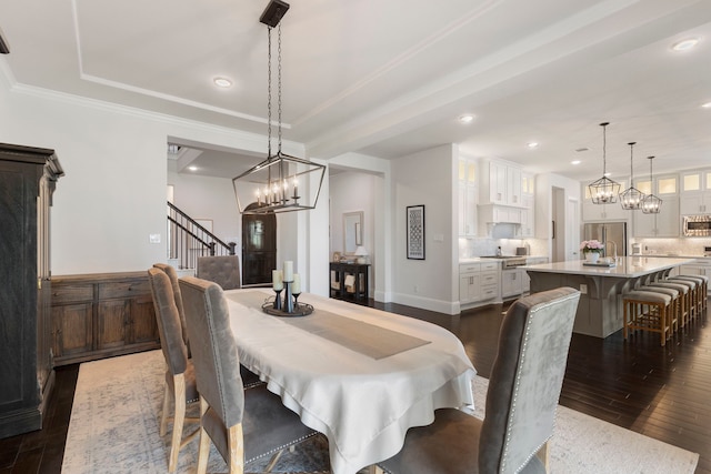 6914 Champion Trl, Katy, TX 77493 - dining area featuring dark wood-style floors, a chandelier, stairway, recessed lighting, and crown molding