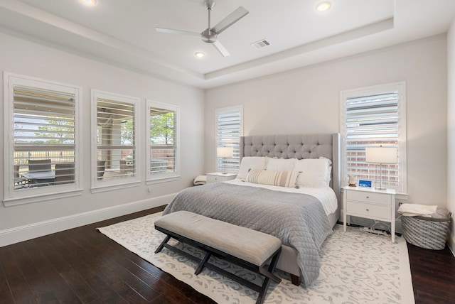 6914 Champion Trl, Katy, TX 77493 - bedroom with a raised ceiling, wood finished floors, recessed lighting, baseboards, and a ceiling fan
