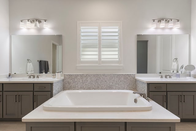 6914 Champion Trl, Katy, TX 77493 - bathroom with a bath and two vanities