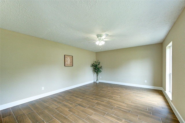 15203 Mcconn St, Houston, TX 77598 - spare room featuring a ceiling fan, wood finish floors, baseboards, and a textured ceiling