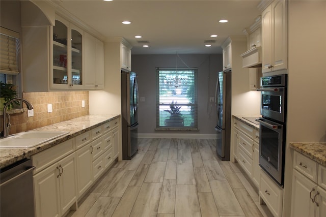 638 Andover St, Spring, TX 77373 - kitchen featuring stainless steel appliances, glass insert cabinets, tasteful backsplash, recessed lighting, and white cabinets