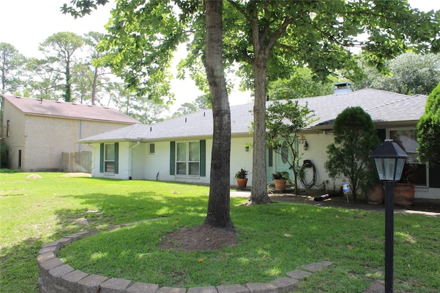 638 Andover St, Spring, TX 77373 - rear view of property with a lawn, brick siding, and a chimney