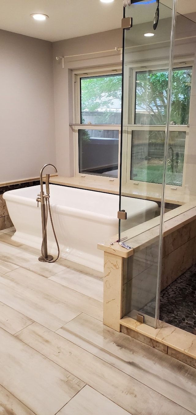 638 Andover St, Spring, TX 77373 - full bathroom featuring a soaking tub, plenty of natural light, and recessed lighting