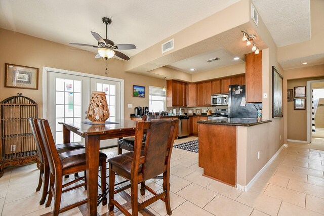 115 Mar Vista Ct, Surfside Beach, TX 77541 - dining space with ceiling fan, light tile patterned flooring, and baseboards