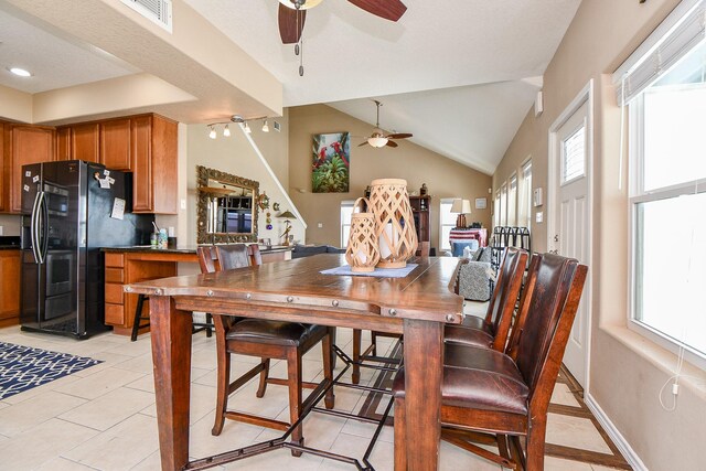 115 Mar Vista Ct, Surfside Beach, TX 77541 - dining area featuring ceiling fan, vaulted ceiling, and light tile patterned flooring