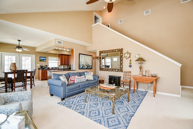 115 Mar Vista Ct, Surfside Beach, TX 77541 - living area with ceiling fan, light colored carpet, high vaulted ceiling, and baseboards