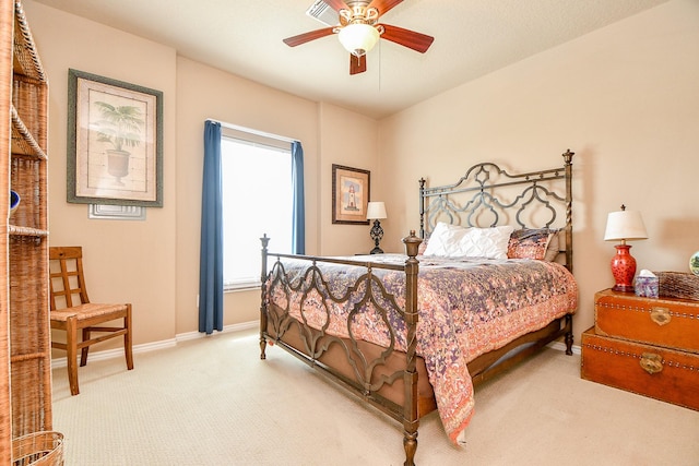 115 Mar Vista Ct, Surfside Beach, TX 77541 - bedroom with light carpet, baseboards, and a ceiling fan