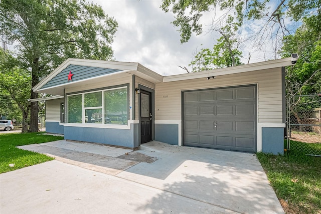 6058 Lyndhurst Dr, Houston, TX 77033 - view of front of home featuring driveway and an attached garage