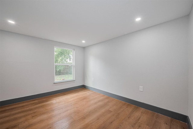 6058 Lyndhurst Dr, Houston, TX 77033 - spare room featuring wood finished floors, recessed lighting, and baseboards
