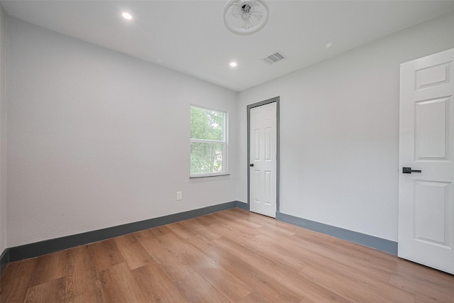 6058 Lyndhurst Dr, Houston, TX 77033 - spare room with light wood-type flooring, baseboards, and recessed lighting