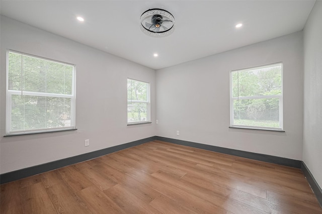 6058 Lyndhurst Dr, Houston, TX 77033 - unfurnished room with wood finished floors, recessed lighting, and baseboards