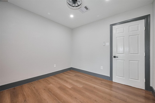 6058 Lyndhurst Dr, Houston, TX 77033 - empty room featuring wood finished floors, baseboards, and recessed lighting