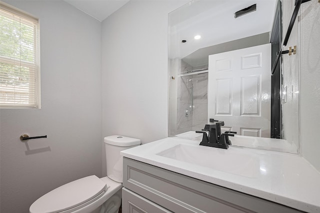 6058 Lyndhurst Dr, Houston, TX 77033 - bathroom with toilet, vanity, and a shower