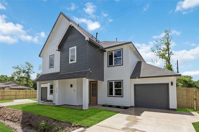 222 Canino Rd A/B, Unit A/B Houston, TX 77076 - view of front facade featuring a shingled roof, an attached garage, board and batten siding, concrete driveway, and covered porch