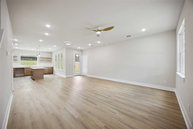 222 Canino Rd A/B, Unit A/B Houston, TX 77076 - unfurnished living room with a ceiling fan, light wood finished floors, recessed lighting, and baseboards