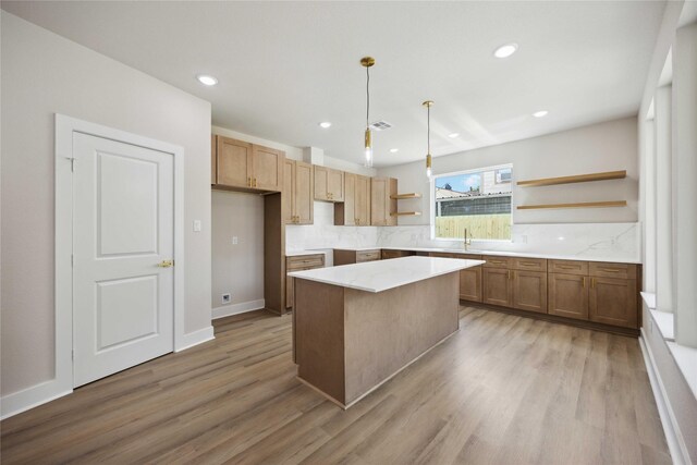 222 Canino Rd A/B, Unit A/B Houston, TX 77076 - kitchen with open shelves, light wood-style floors, a center island, a sink, and backsplash