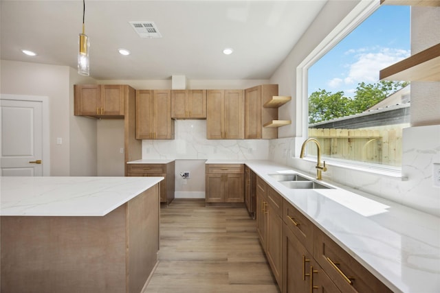 222 Canino Rd A/B, Unit A/B Houston, TX 77076 - kitchen featuring a sink, open shelves, light wood-type flooring, decorative backsplash, and light stone counters