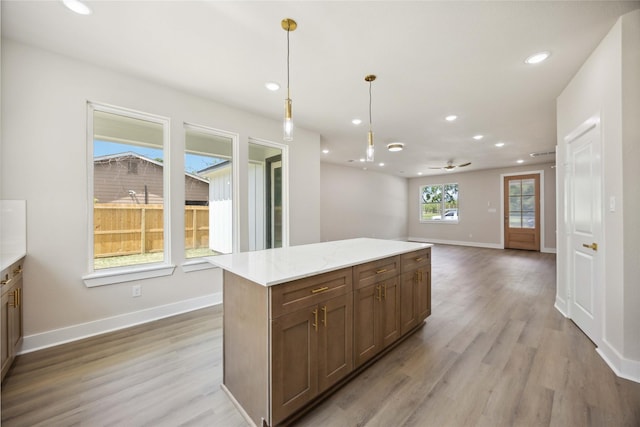 222 Canino Rd A/B, Unit A/B Houston, TX 77076 - kitchen featuring recessed lighting, light wood-style flooring, baseboards, and pendant lighting
