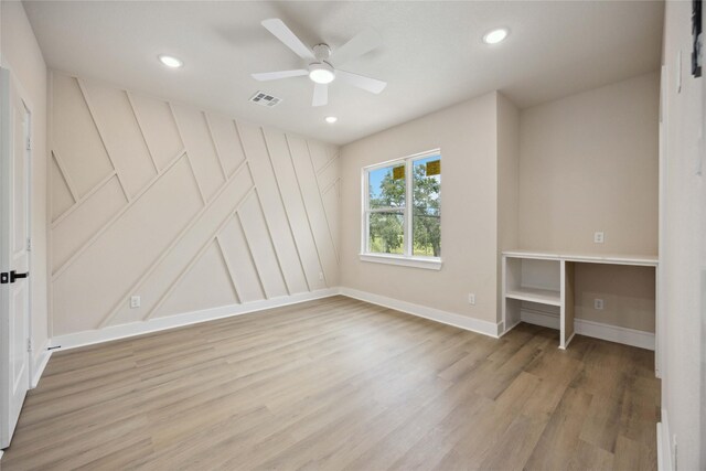 222 Canino Rd A/B, Unit A/B Houston, TX 77076 - unfurnished bedroom featuring light wood-type flooring, recessed lighting, baseboards, a decorative wall, and ceiling fan