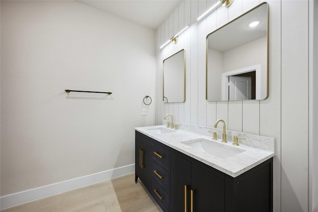222 Canino Rd A/B, Unit A/B Houston, TX 77076 - full bath with wood finished floors, baseboards, and double vanity