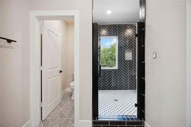 222 Canino Rd A/B, Unit A/B Houston, TX 77076 - bathroom featuring toilet, baseboards, and tile patterned floors