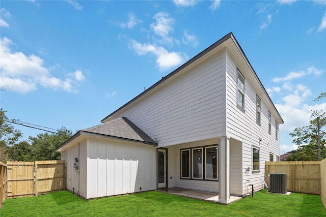 222 Canino Rd A/B, Unit A/B Houston, TX 77076 - back of property with a patio, central AC, and a shingled roof